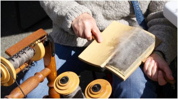 Why does carding wool matter before spinning or felting?